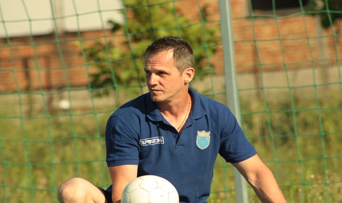 Coach distributing balls in the training session